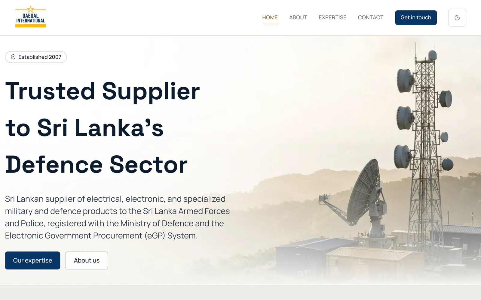 Daedal International home page with the company headline, Our expertise and About us buttons and a telecom tower photo, on a laptop